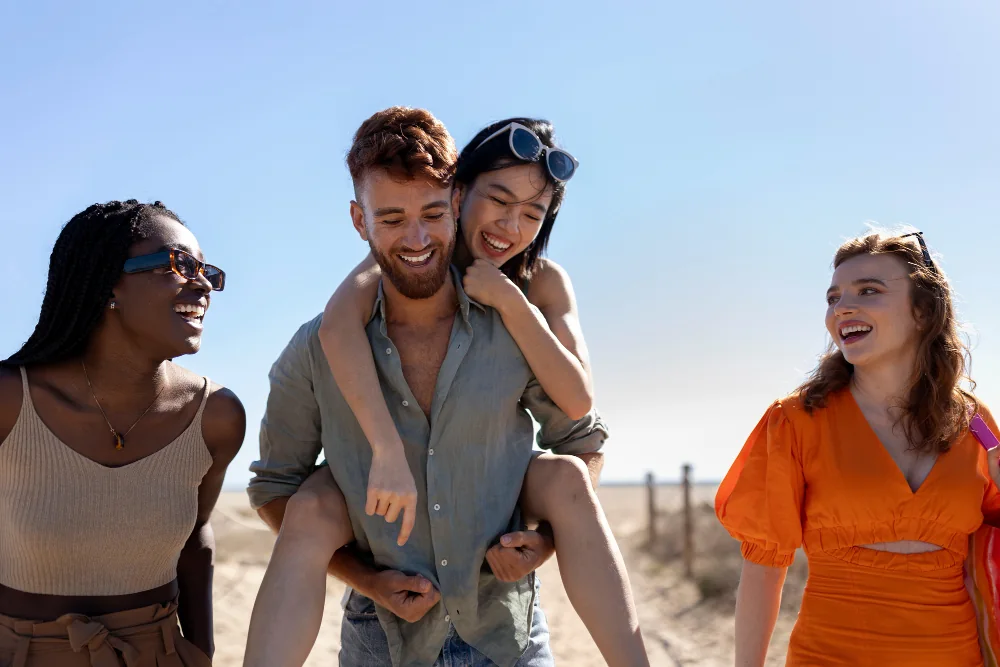 Four friends enjoying time together at the beach